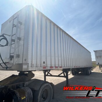 Wilkens Walking Floor Semi-Trailer (24-624) nose view showing the front ladder, stinger hose hanger, and sheet and post design and a front mount pressure gauge.